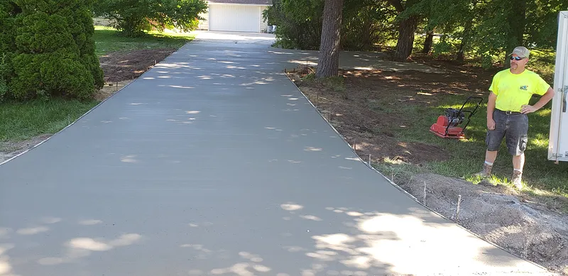 Fresh broom-finished concrete driveway at a Saginaw-area home